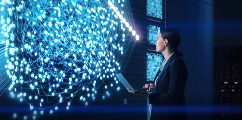 Engineer at a wall of networked data in a Yokogawa digital operations setting